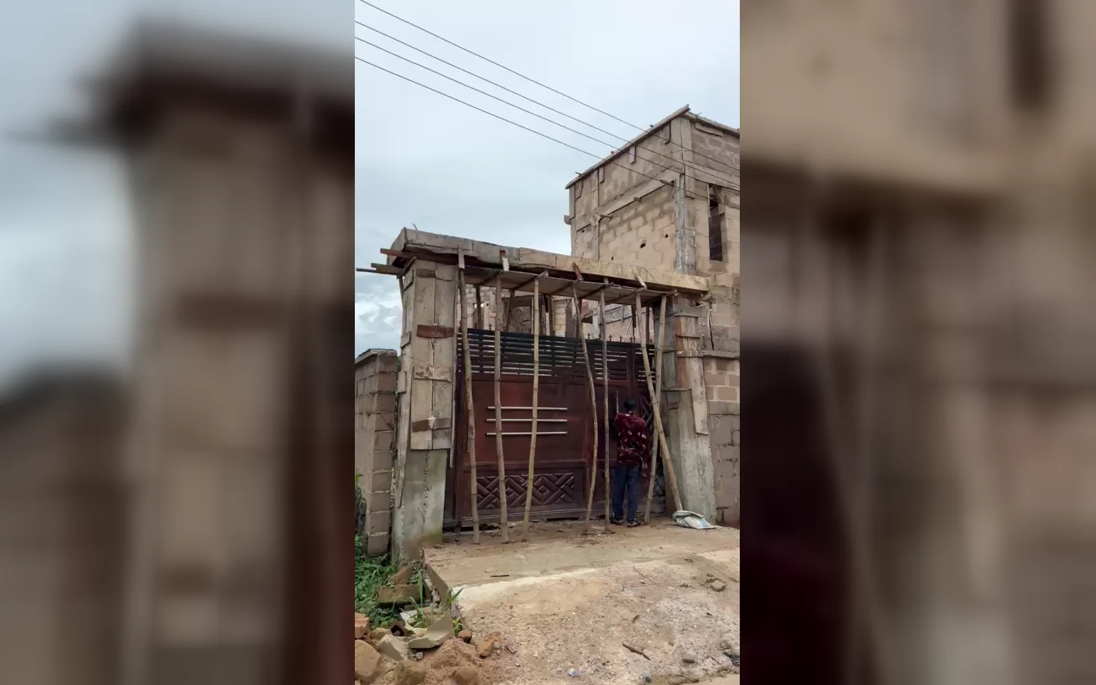 Gate and current construction stage of the ongoing six-bedroom duplex in Umuabi, Udi LGA